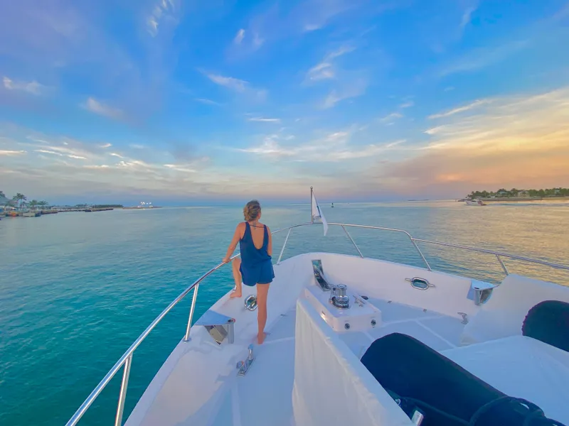 Slide: The Image of Woman enjoying sunset on 2023 Outer Reef Yachts 720 Azure Motoryacht deck. - 36