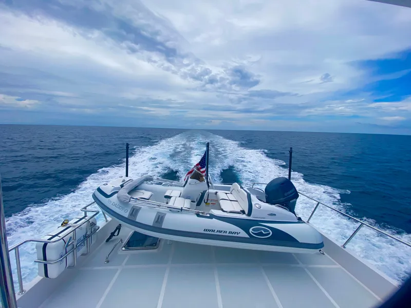 Slide: The Image of 2023 Outer Reef Yachts 720 Azure cruising with tender on deck, open ocean view. - 38