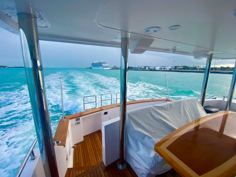 Slide: The Image of 2023 Outer Reef Yachts 720 Azure Custom Cockpit Motoryacht cruising on turquoise waters. - 6