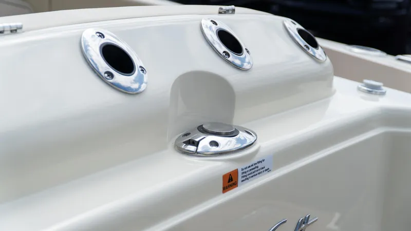 Slide: The Image of 2025 Chris-Craft Calypso 28 boat detail with chrome fittings and warning label. - 12