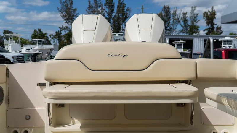 Slide: The Image of 2025 Chris-Craft Calypso 28 boat with beige seating, dual engines, and sleek design. - 16