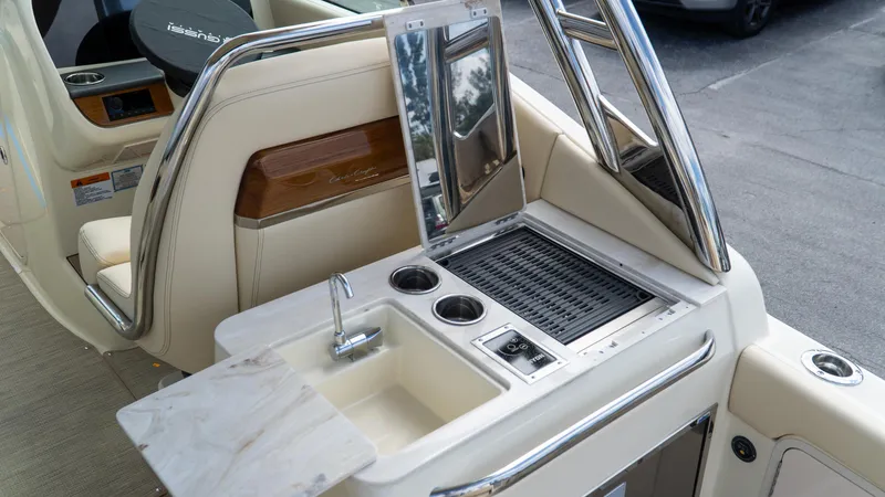 Slide: The Image of 2025 Chris-Craft Calypso 28 boat interior with sink and grill station. - 23