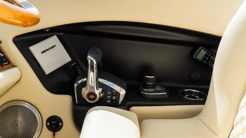 Slide: The Image of Control panel of 2025 Chris-Craft Calypso 28 boat with Mercury throttle. - 41