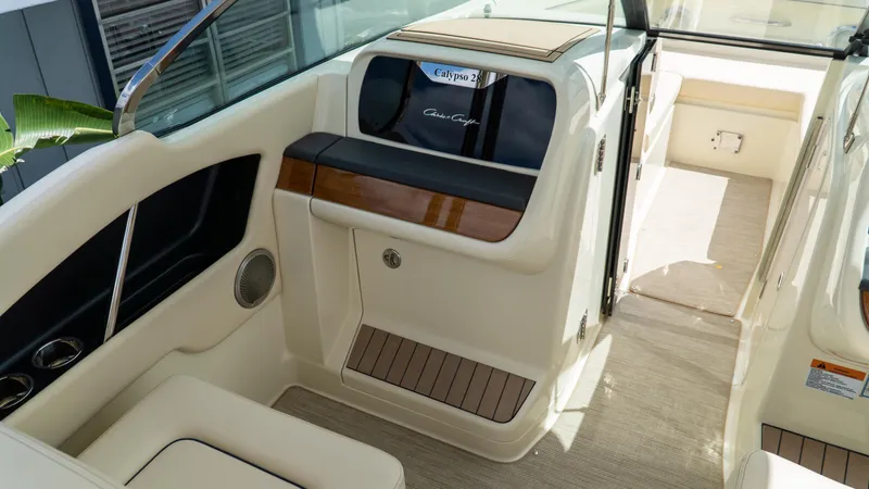 Slide: The Image of 2025 Chris-Craft Calypso 28 interior with elegant seating and wood accents. - 46
