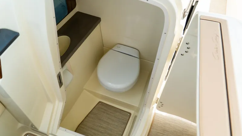 Slide: The Image of 2025 Chris-Craft Calypso 28 boat interior bathroom with modern toilet and sink. - 47