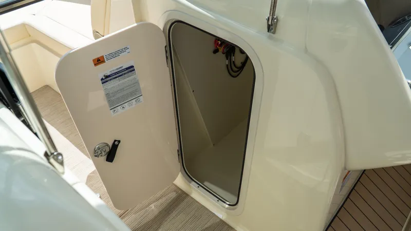 Slide: The Image of Open hatch on 2025 Chris-Craft Calypso 28 boat, showcasing interior access. - 49