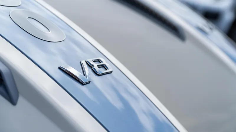 Slide: The Image of 2025 Chris-Craft Calypso 28 with V8 engine emblem on sleek surface. - 8