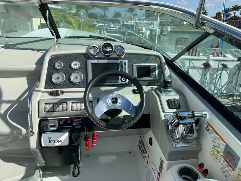 Slide: The Image of Cockpit of 2011 Formula 350 Sun Sport boat with steering wheel and control panel. - 10