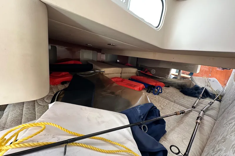 Slide: The Image of 2011 Formula 350 Sun Sport cabin with fishing gear and life jackets. - 22