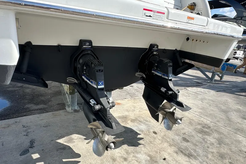 Slide: The Image of 2011 Formula 350 Sun Sport boat with dual outboard motors on a concrete surface. - 7