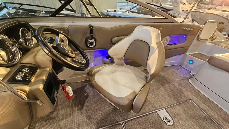 Slide: The Image of 2020 Crownline Eclipse E215 XS boat interior with steering wheel and seating. - 15