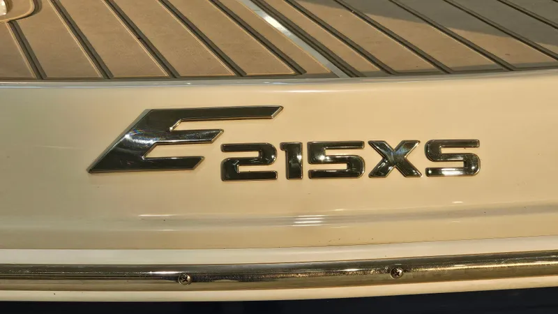 Slide: The Image of 2020 Crownline Eclipse E215 XS boat emblem on deck. - 31