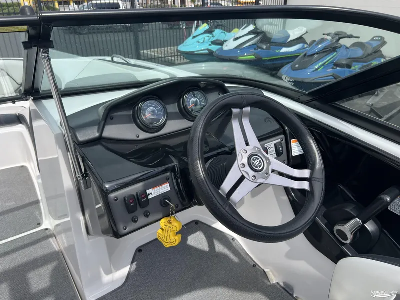 Slide: The Image of 2018 Yamaha Boats AR195 dashboard with steering wheel and gauges. - 5
