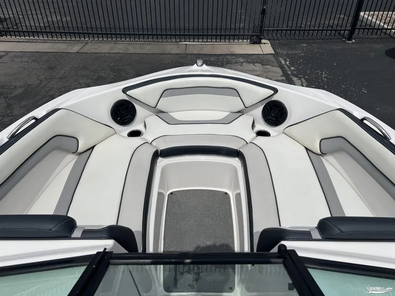 Slide: The Image of 2018 Yamaha AR195 boat interior with white cushioned seating and speakers. - 6