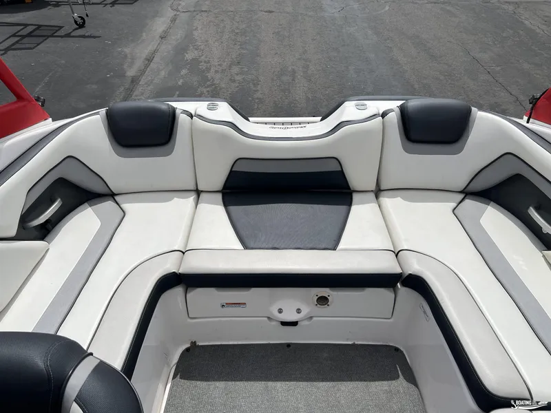 Slide: The Image of 2018 Yamaha AR195 boat interior with white and black seating. - 8