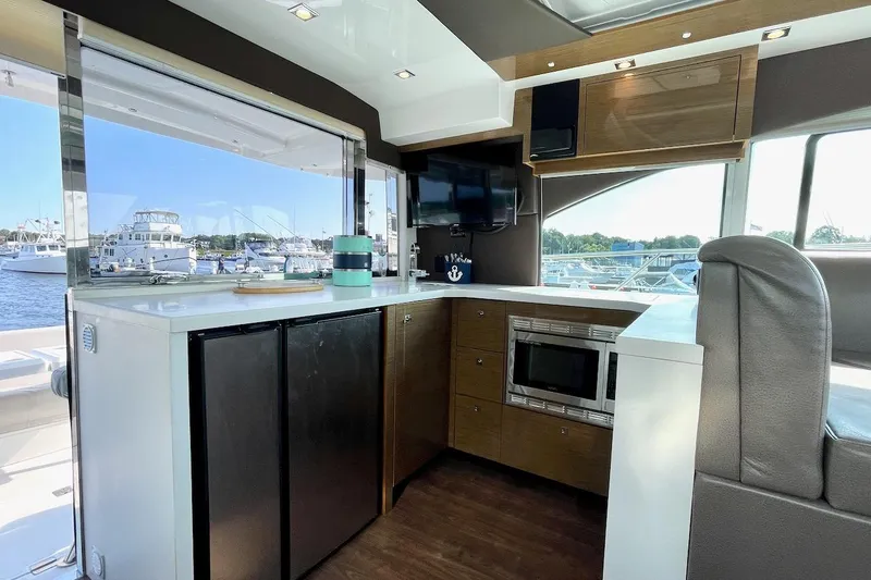 Slide: The Image of Luxurious interior of 2018 Cruisers Yachts 45 Cantius with modern kitchen amenities. - 19
