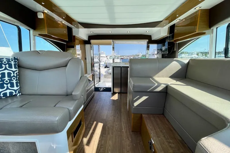 Slide: The Image of Interior of 2018 Cruisers Yachts 45 Cantius with modern seating and wood flooring. - 22