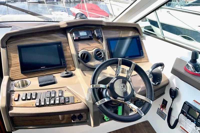 Slide: The Image of Helm of 2018 Cruisers Yachts 45 Cantius with modern navigation controls and displays. - 28