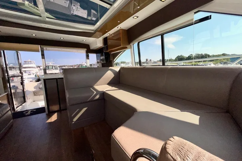 Slide: The Image of Luxurious interior of 2018 Cruisers Yachts 45 Cantius with panoramic windows and plush seating. - 41