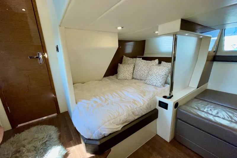 Slide: The Image of Luxurious bedroom interior of 2018 Cruisers Yachts 45 Cantius with cozy bedding. - 44
