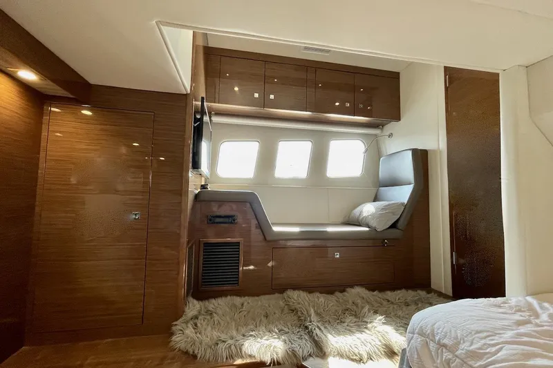 Slide: The Image of Luxurious interior of 2018 Cruisers Yachts 45 Cantius with cozy seating and elegant wood finish. - 45