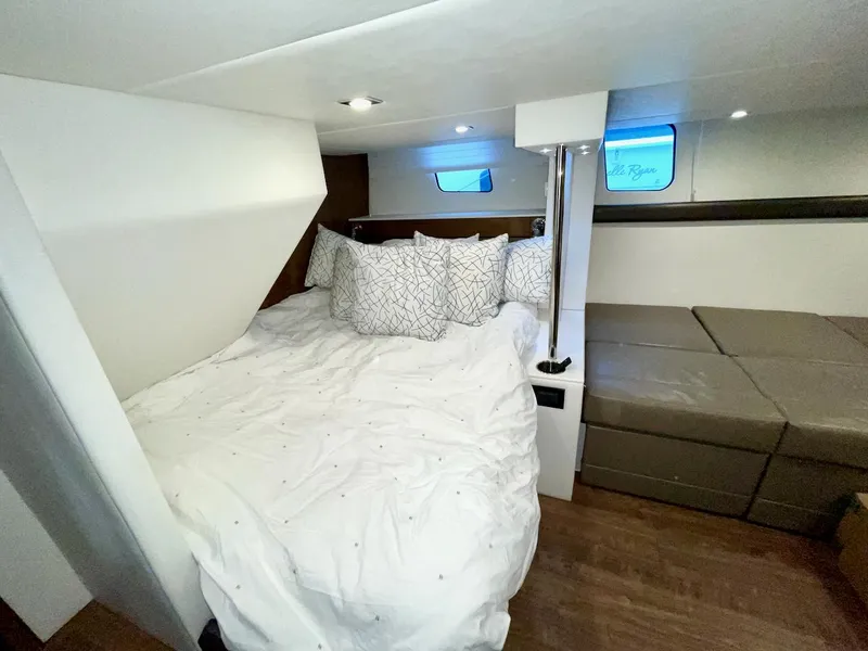 Slide: The Image of 2018 Cruisers 45 Cantius yacht bedroom with cozy bed and modern decor. - 47