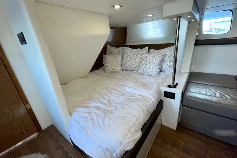 Slide: The Image of Luxurious bedroom interior of 2018 Cruisers Yachts 45 Cantius with cozy bedding. - 48