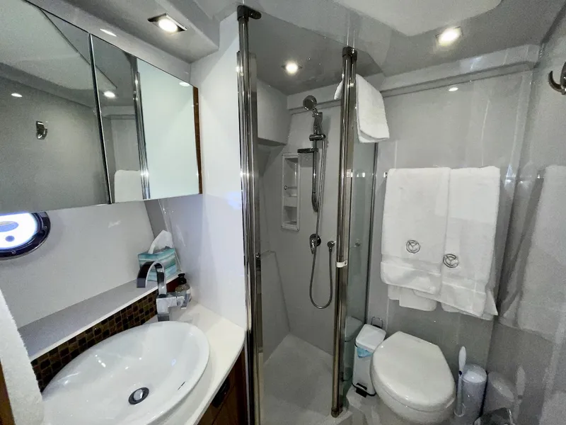 Slide: The Image of Luxurious bathroom in 2018 Cruisers 45 Cantius yacht with modern fixtures and elegant design. - 55