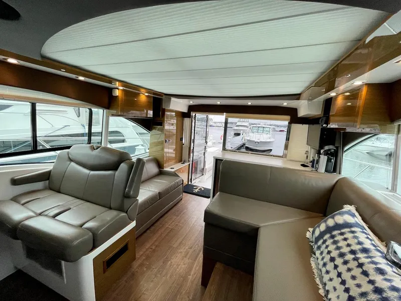 Slide: The Image of Interior of 2018 Cruisers 45 Cantius yacht with modern seating and wood flooring. - 6