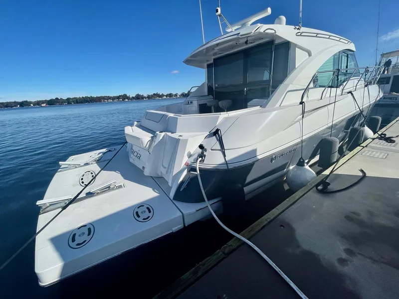 Slide: The Image of 2018 Cruisers 45 Cantius yacht docked on a sunny day. - 64