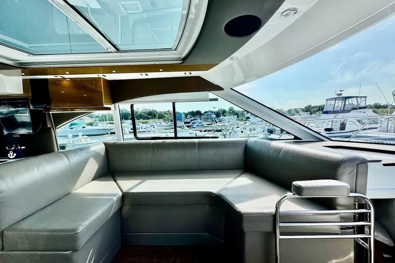Slide: The Image of Luxurious interior of 2018 Cruisers Yachts 45 Cantius with marina view. - 38