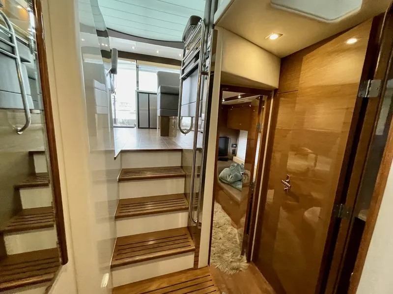Slide: The Image of 2018 Cruisers 45 Cantius yacht interior with wooden stairs and modern design. - 51