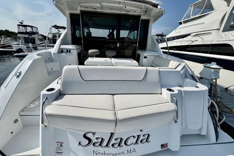 Slide: The Image of 2018 Cruisers Yachts 45 Cantius, rear view with seating, docked in Newburyport, MA. - 72