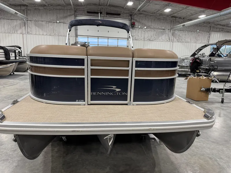 Slide: The Image of 2018 Bennington G 25 pontoon boat in a showroom, front view. - 3