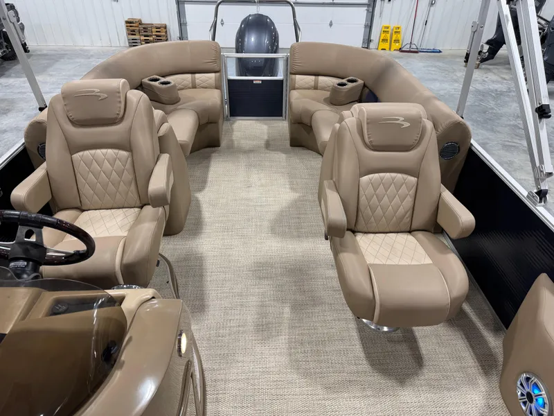 Slide: The Image of 2018 Bennington G 25 pontoon boat interior with luxurious tan seating and modern design. - 8