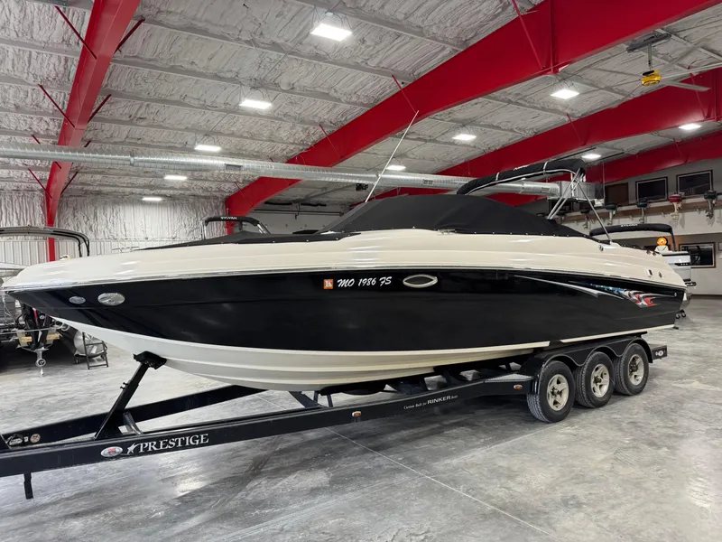 Slide: The Image of 2005 Rinker 282 Captiva Bowrider on trailer in indoor storage facility. - 16