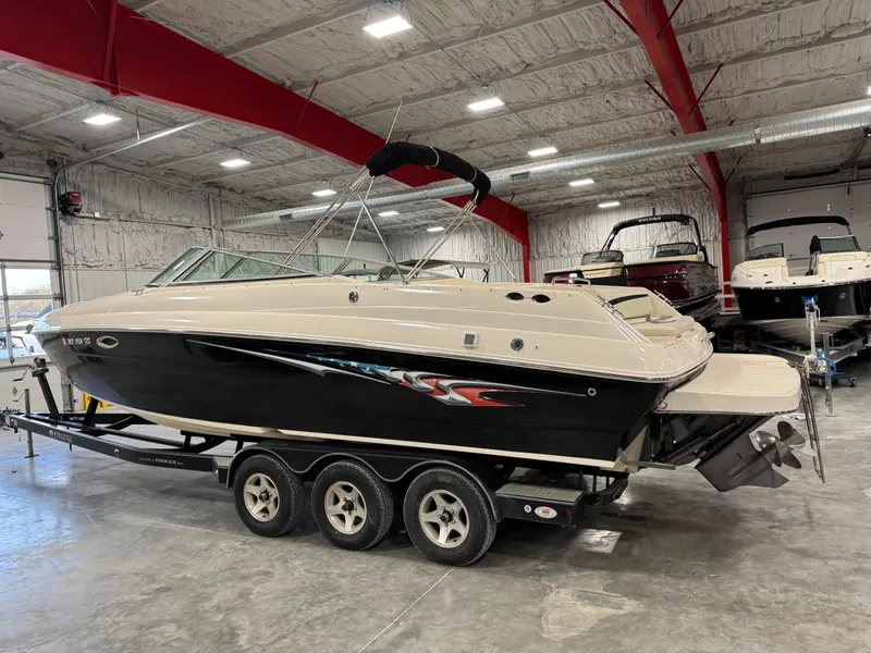 Slide: The Image of 2005 Rinker 282 Captiva Bowrider boat on trailer in indoor storage facility. - 3