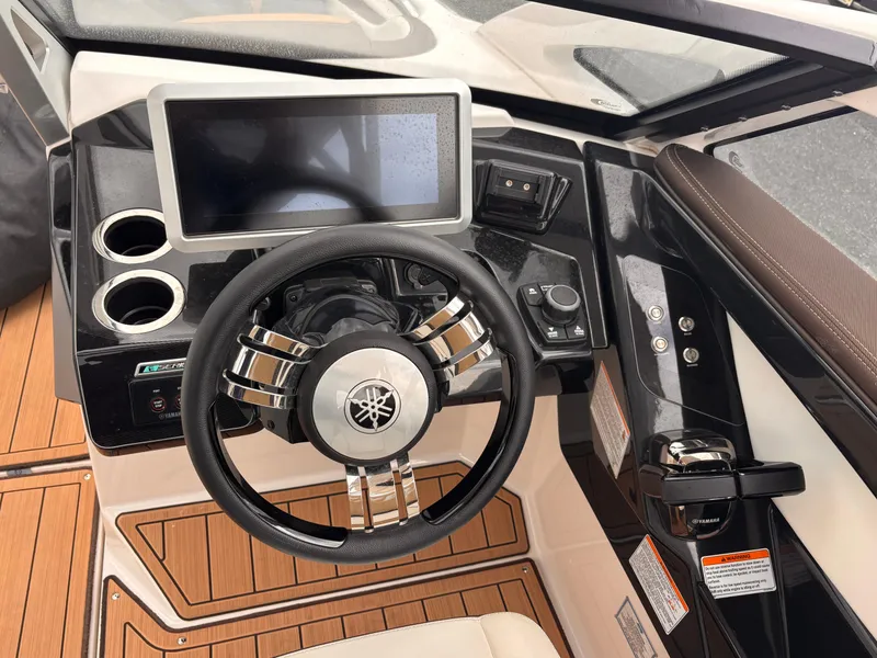 Slide: The Image of Steering wheel and dashboard of 2021 Yamaha Boats 275 SD with touchscreen display. - 15