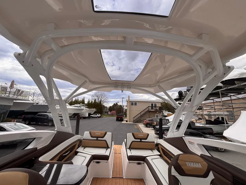 Slide: The Image of 2021 Yamaha Boats 275 SD interior with spacious seating and modern design. - 18