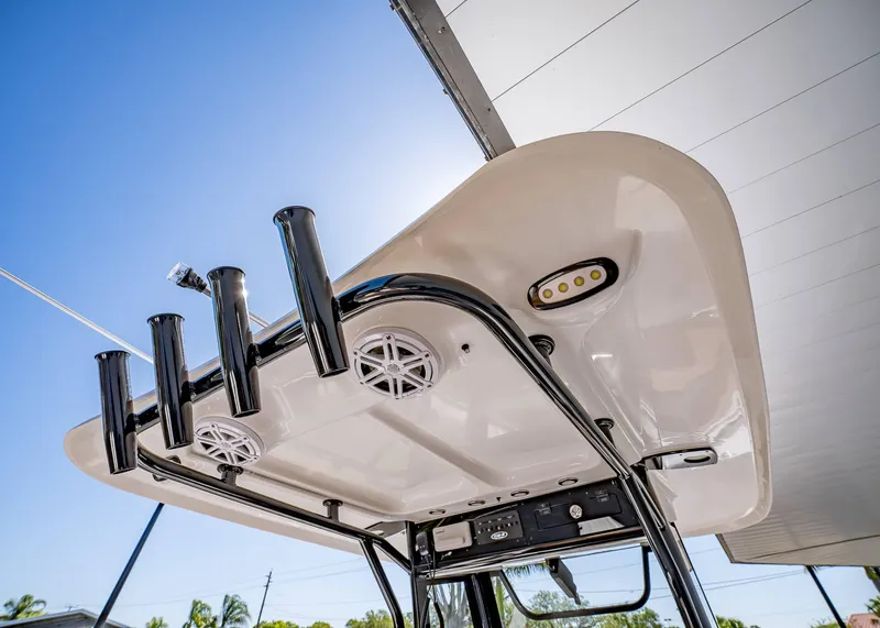 Slide: The Image of 2025 Sea Hunt Ultra 265 SE boat top view with rod holders and speakers. - 19