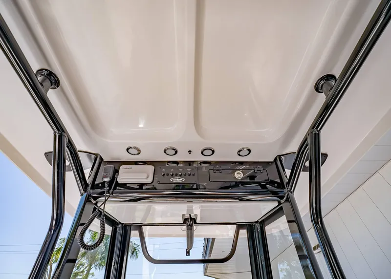 Slide: The Image of 2025 Sea Hunt Ultra 265 SE boat console with electronics and controls. - 21