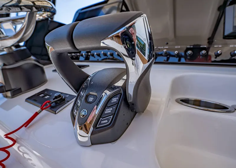 Slide: The Image of Close-up of 2025 Sea Hunt Ultra 265 SE boat controls and throttle. - 27