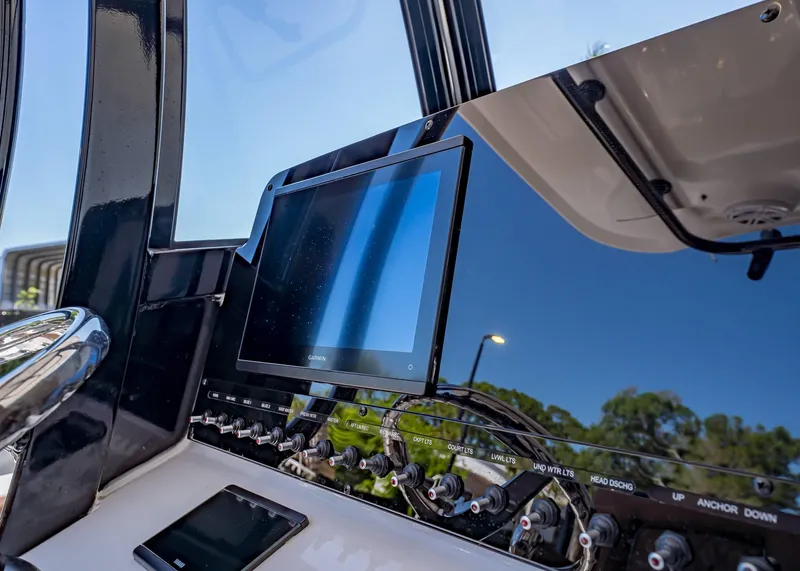 Slide: The Image of Control panel of 2025 Sea Hunt Ultra 265 SE boat with Garmin display. - 28