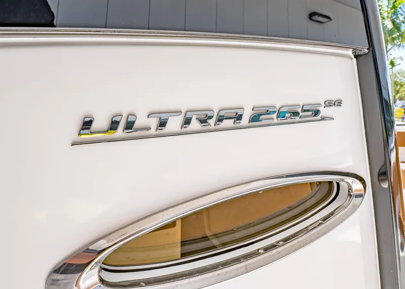 Slide: The Image of 2025 Sea Hunt Ultra 265 SE boat emblem on white surface. - 31