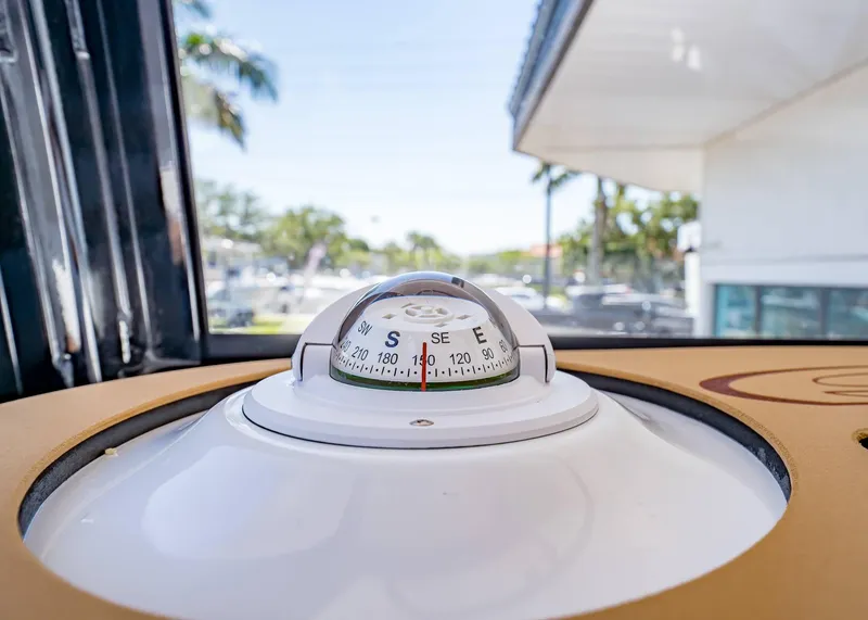 Slide: The Image of Compass on 2025 Sea Hunt Ultra 265 SE boat, with outdoor view. - 32