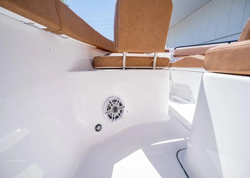 Slide: The Image of Interior view of 2025 Sea Hunt Ultra 265 SE boat with tan seating and speaker. - 34