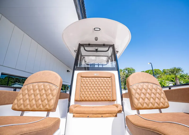 Slide: The Image of 2025 Sea Hunt Ultra 265 SE boat with luxurious tan seating and sleek design. - 36