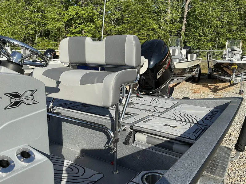 Slide: The Image of 2025 Xpress Hyper-Lift Series H20B boat with new console, featuring sleek seating and modern design. - 8