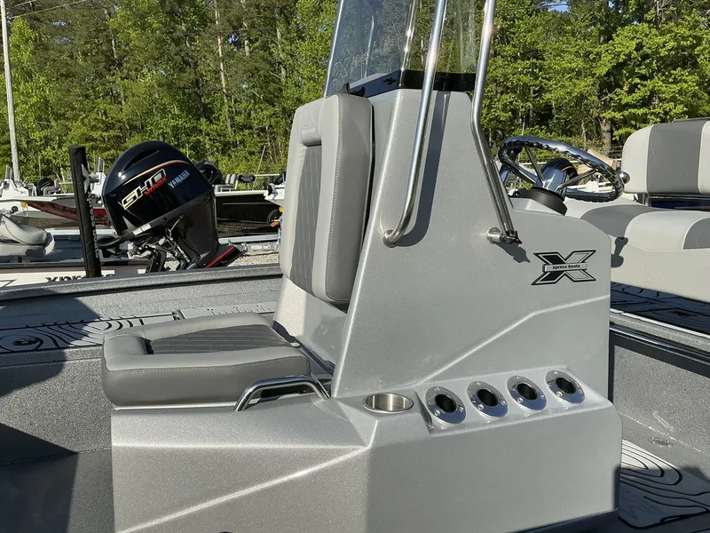 Slide: The Image of 2025 Xpress Hyper-Lift Series H20B boat console with seating and Yamaha outboard motor. - 9