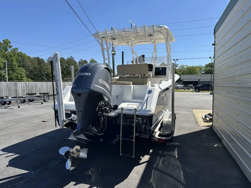 Slide: The Image of 2017 Sea Hunt Edge 24 boat with Yamaha 300 engine, parked outdoors. - 4